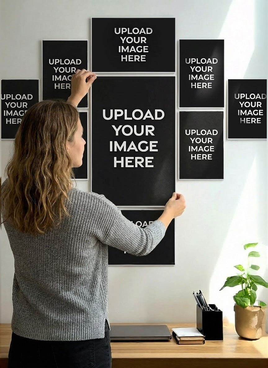Woman uploading an image onto a wall-mounted photo frame with multiple slots.